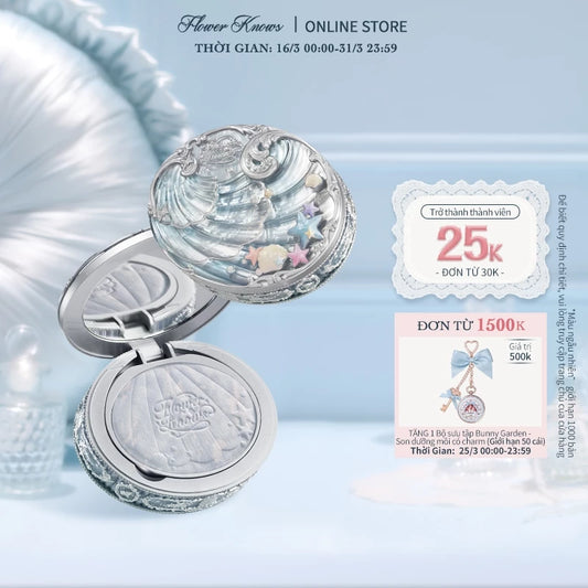 Silver seashell compact mirror displayed on a light blue background